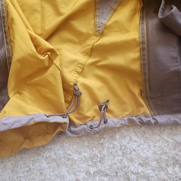 The North Face Flight SerieYellow and Gray Windbreaker.